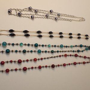 4 assorted bead necklace white black green red